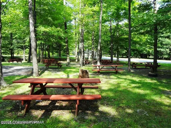 a view of backyard with sitting area