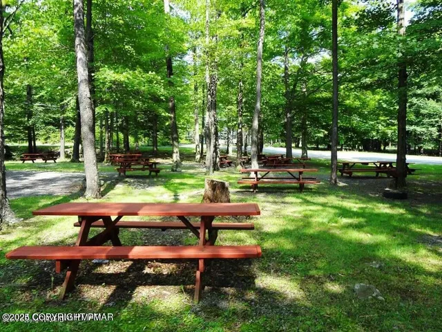a view of backyard with sitting area