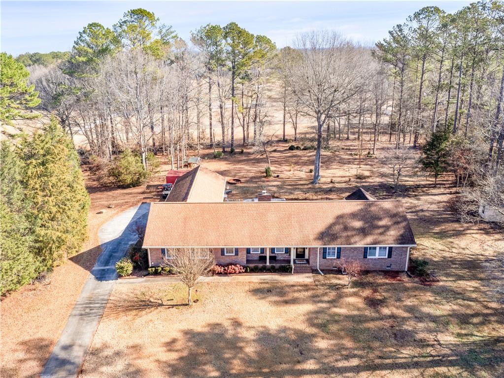 a view of a house with a yard and covered with snow
