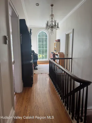 a view of a room that has a bed and a window