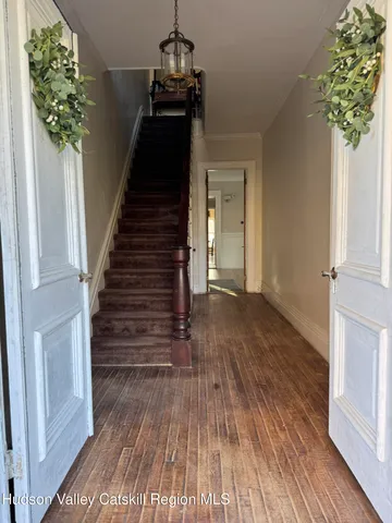 a view of entryway with wooden floor