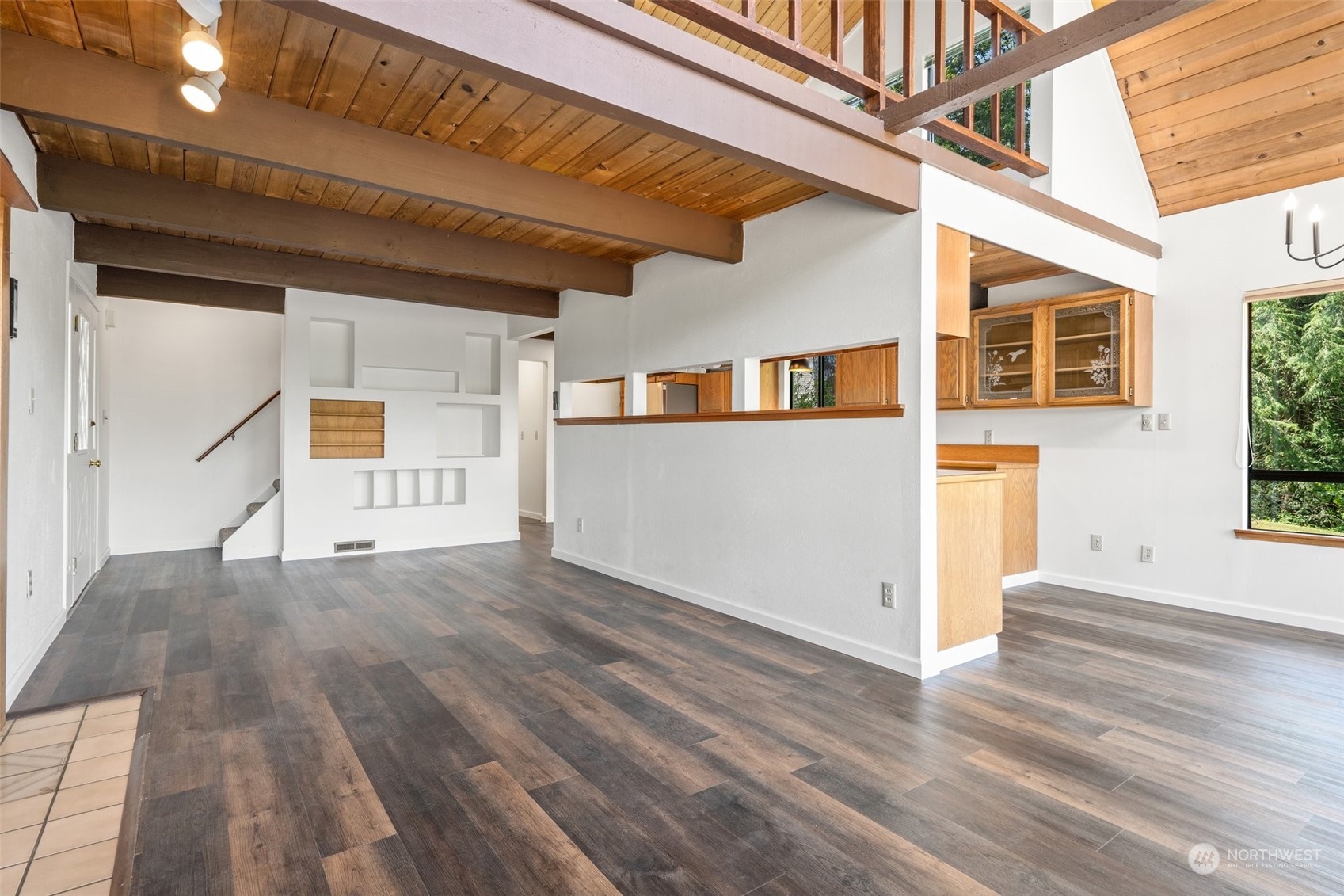 240 East Canyon View Road Belfair, WA 98528 - Photo 12 of 38 a view of a porch with wooden floor and stairs
