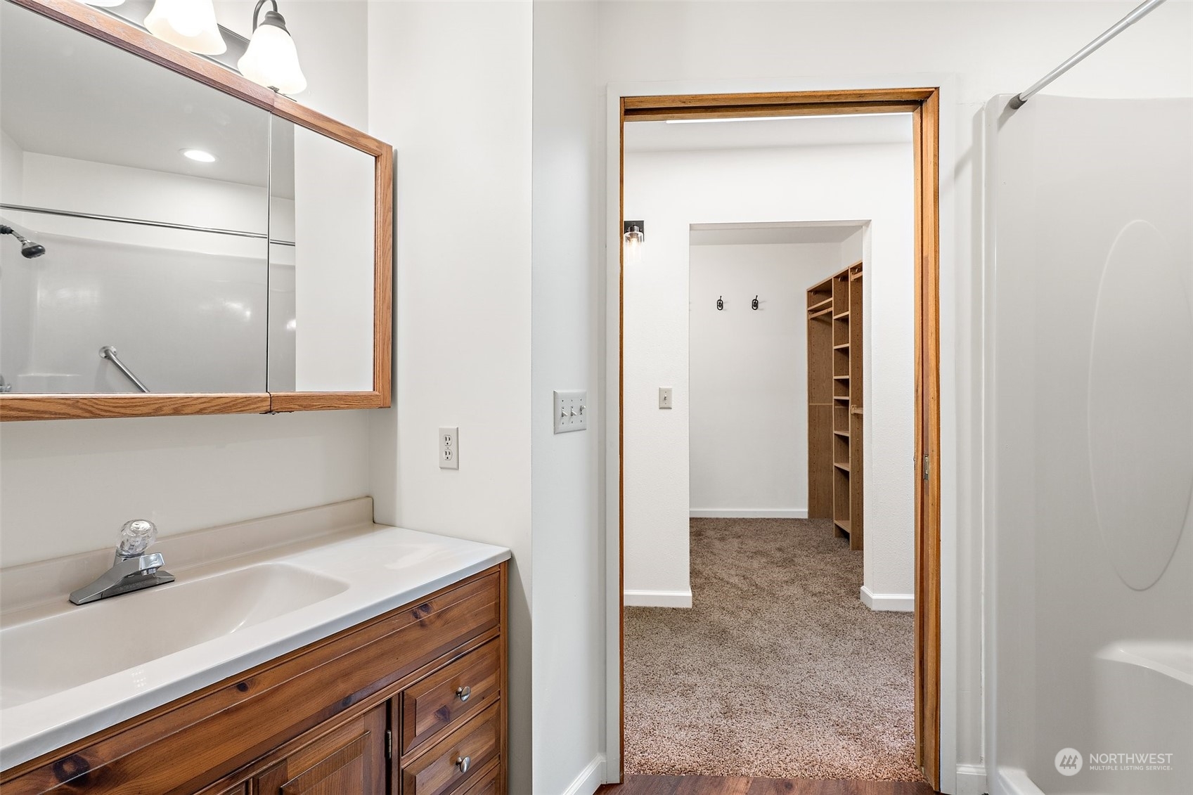 240 East Canyon View Road Belfair, WA 98528 - Photo 19 of 38 a bathroom with a sink and a mirror