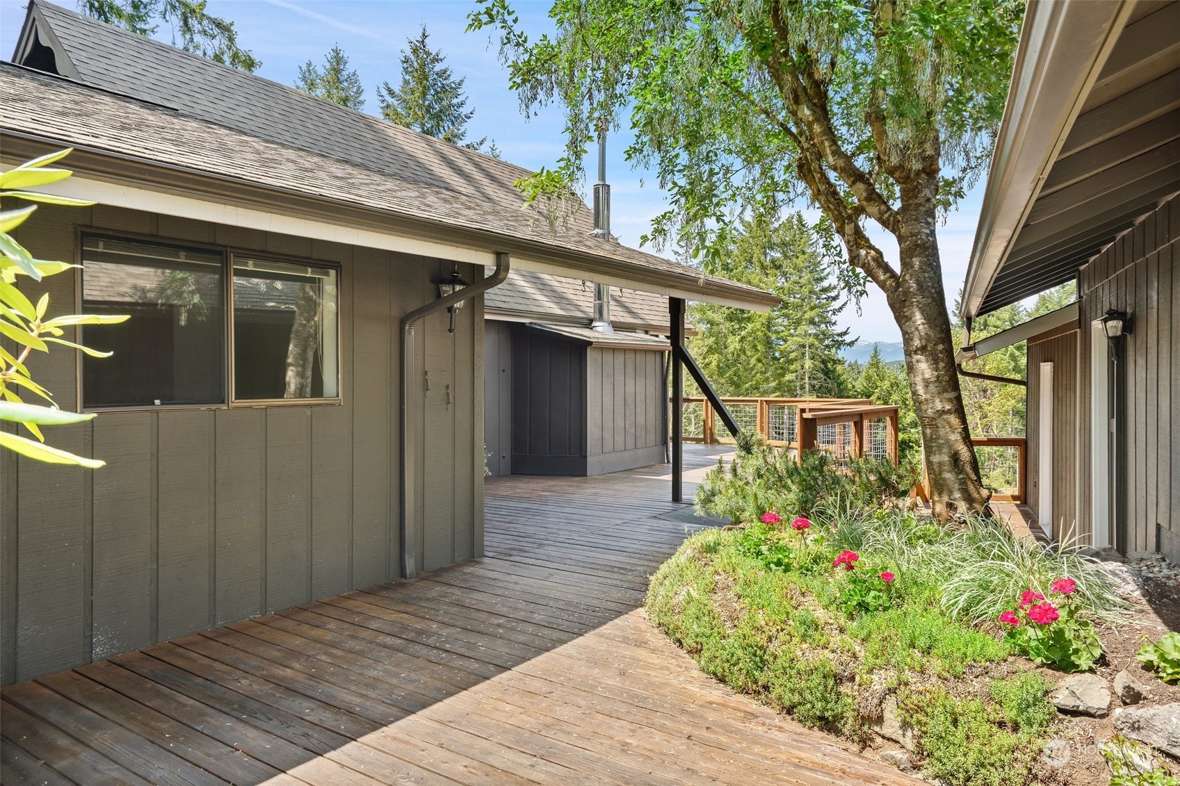 240 East Canyon View Road Belfair, WA 98528 - Photo 26 of 38 a front view of a house with garden