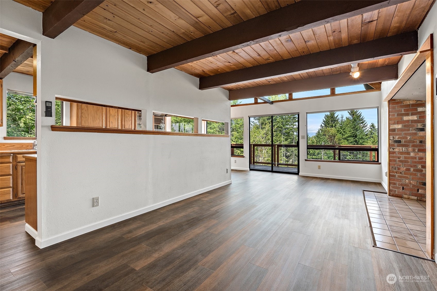 240 East Canyon View Road Belfair, WA 98528 - Photo 8 of 38 a view of a room with wooden floor and large windows