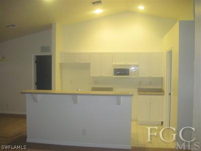 1541 Meadow Road Lehigh Acres, FL 33976 - Photo 3 of 3 a bathroom with a sink and a mirror