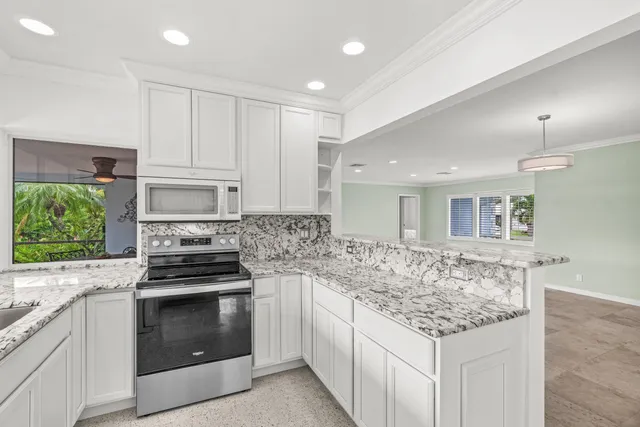 a kitchen with a stove and a sink