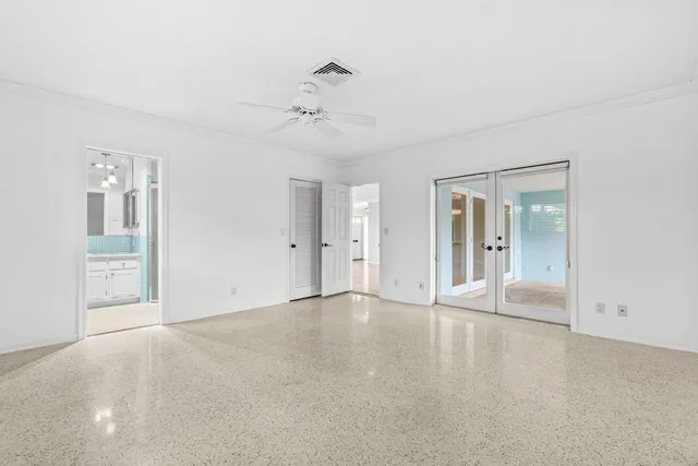 a view of an empty room with a bathroom