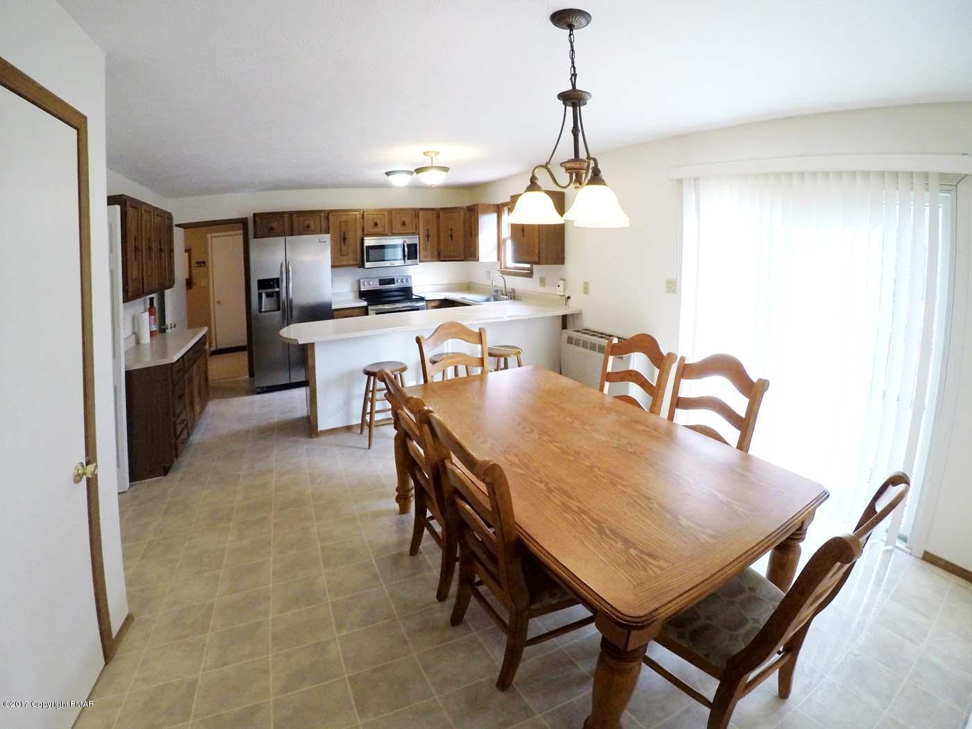 50 Dancing Ridge Road East Stroudsburg, PA 18302 - Photo 8 of 25 a dining room with furniture a chandelier and window