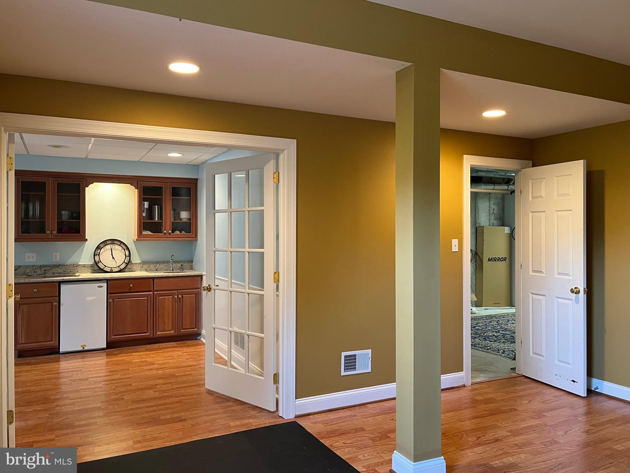 23 Springlea Lane Chester Springs, PA 19425 - Photo 59 of 65 Wetbar and door to expansive storage space