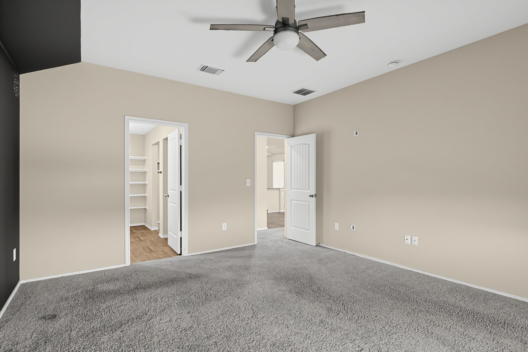 11810 Pyrite Road Manor, TX 78653 - Photo 21 of 38 Plush wall-to-wall carpeting and neutral tones create a quiet, comfortable bedroom retreat.