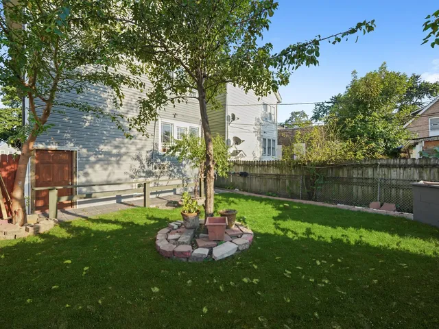 a view of a backyard with a small cabin