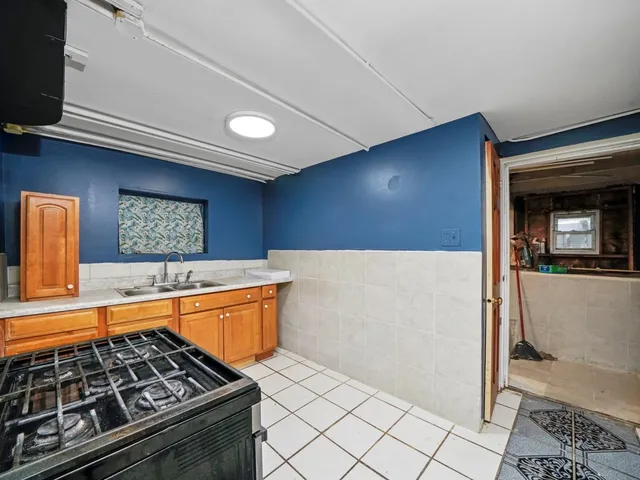 a kitchen with stainless steel appliances granite countertop a stove and a sink