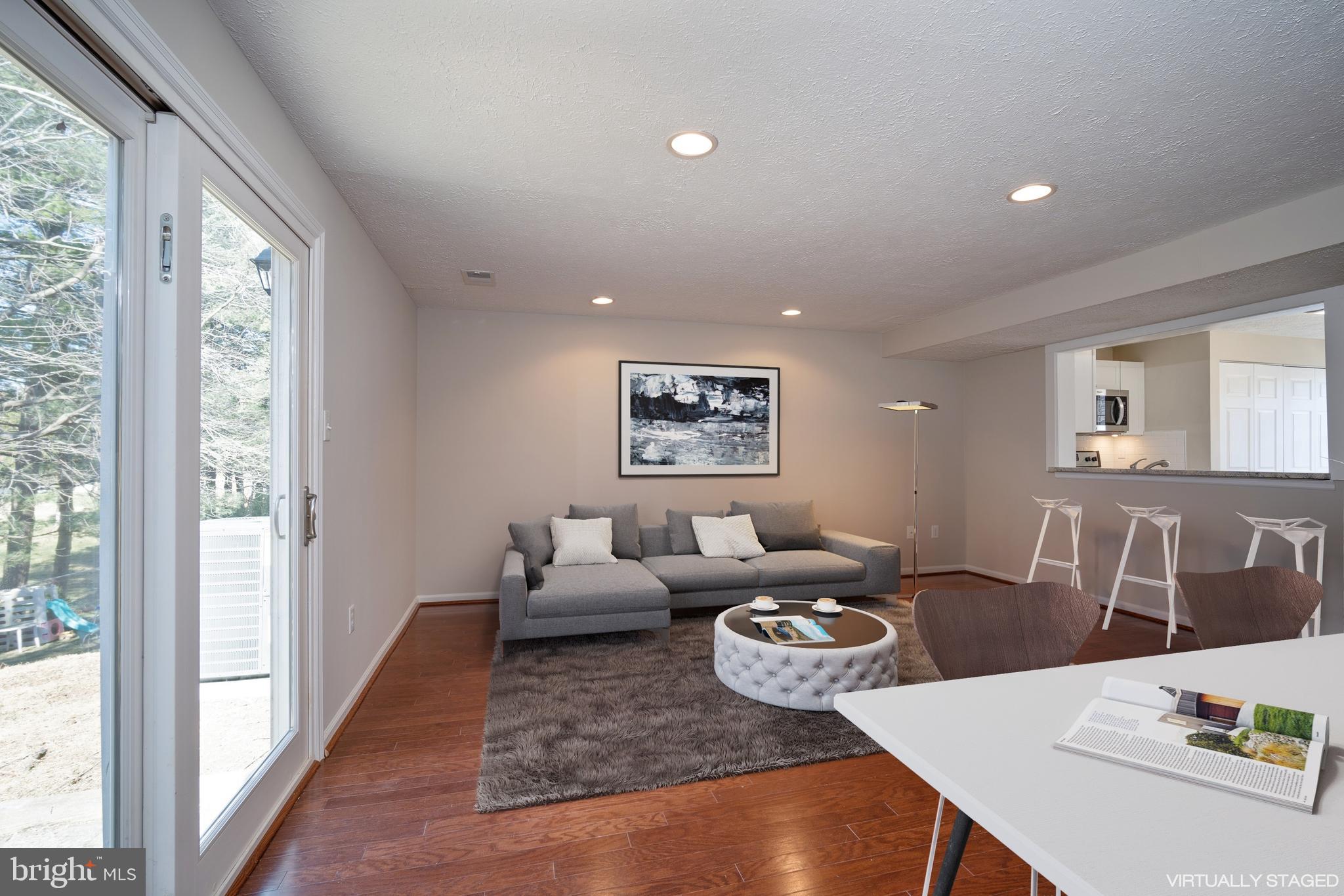 10149 Shelldrake Circle Damascus, MD 20872 - Photo 13 of 28 a living room with furniture and a table
