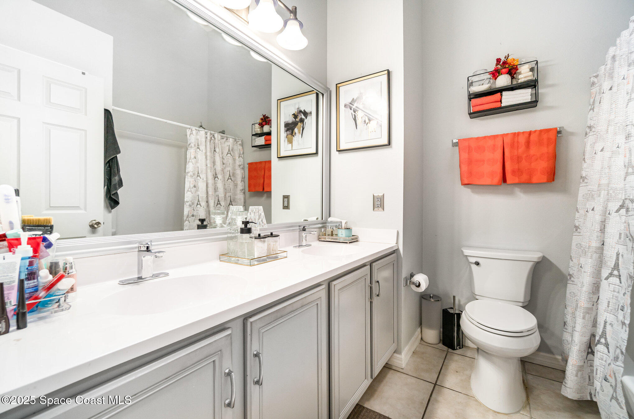 1350 Creekview Court St. Cloud, FL 34772 - Photo 20 of 27 a bathroom with a toilet sink and mirror