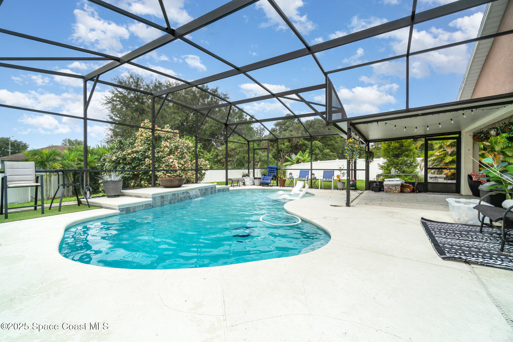 1350 Creekview Court St. Cloud, FL 34772 - Photo 23 of 27 a view of a swimming pool with a patio