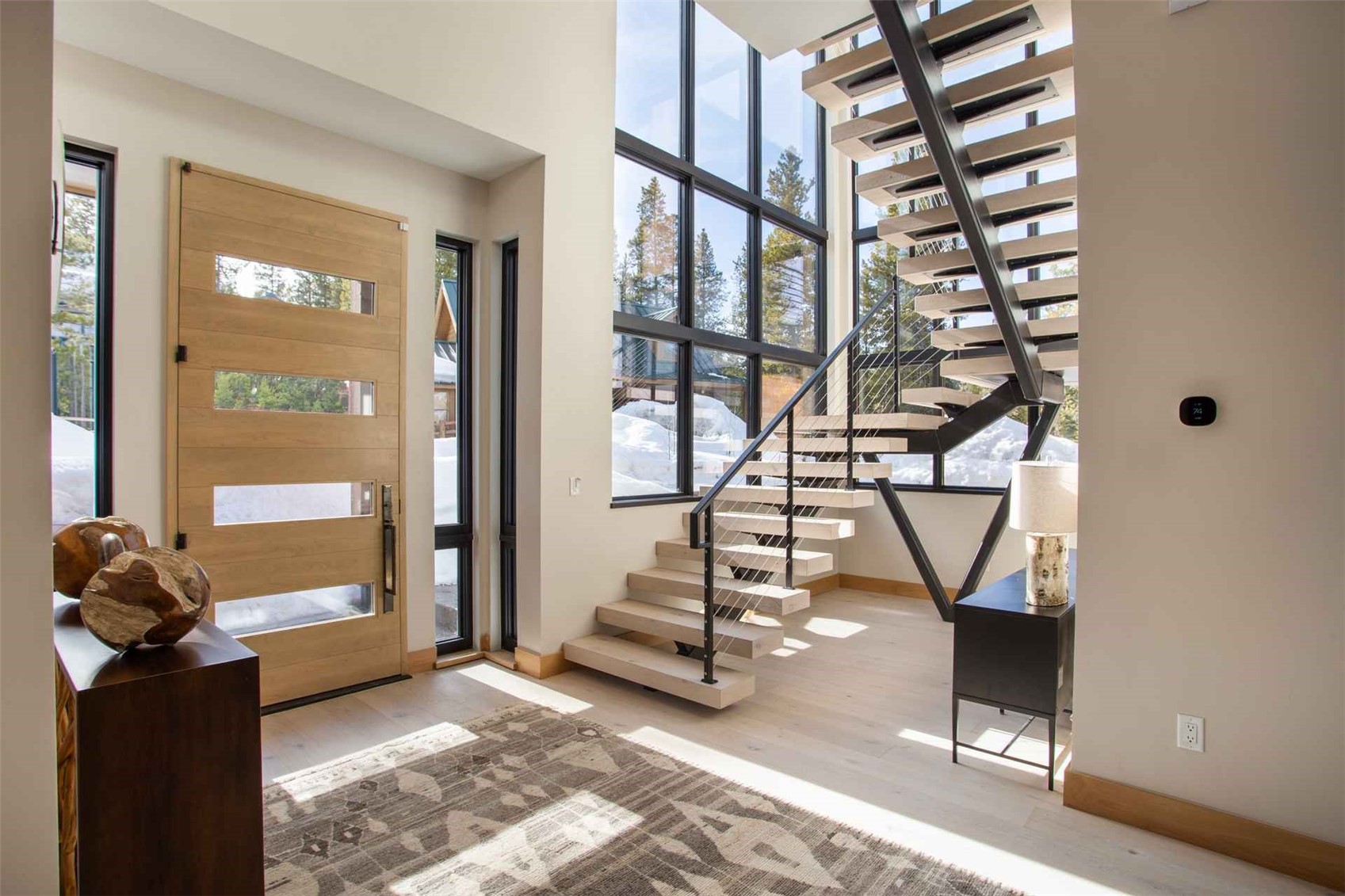 3764 Ski Hill Road Breckenridge, CO 80424 - Photo 14 of 30 Entryway with a high ceiling and light wood-style flooring