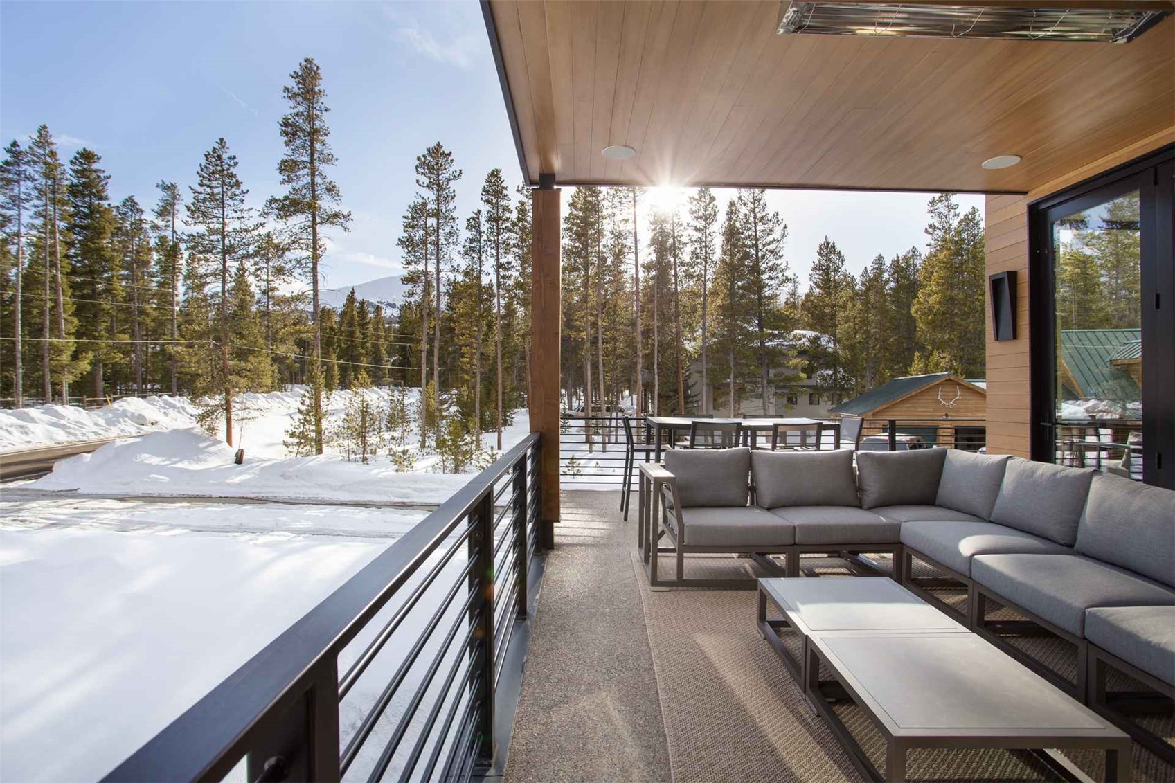 3764 Ski Hill Road Breckenridge, CO 80424 - Photo 18 of 30 Snow covered back of property featuring an outdoor hangout area and a patio area