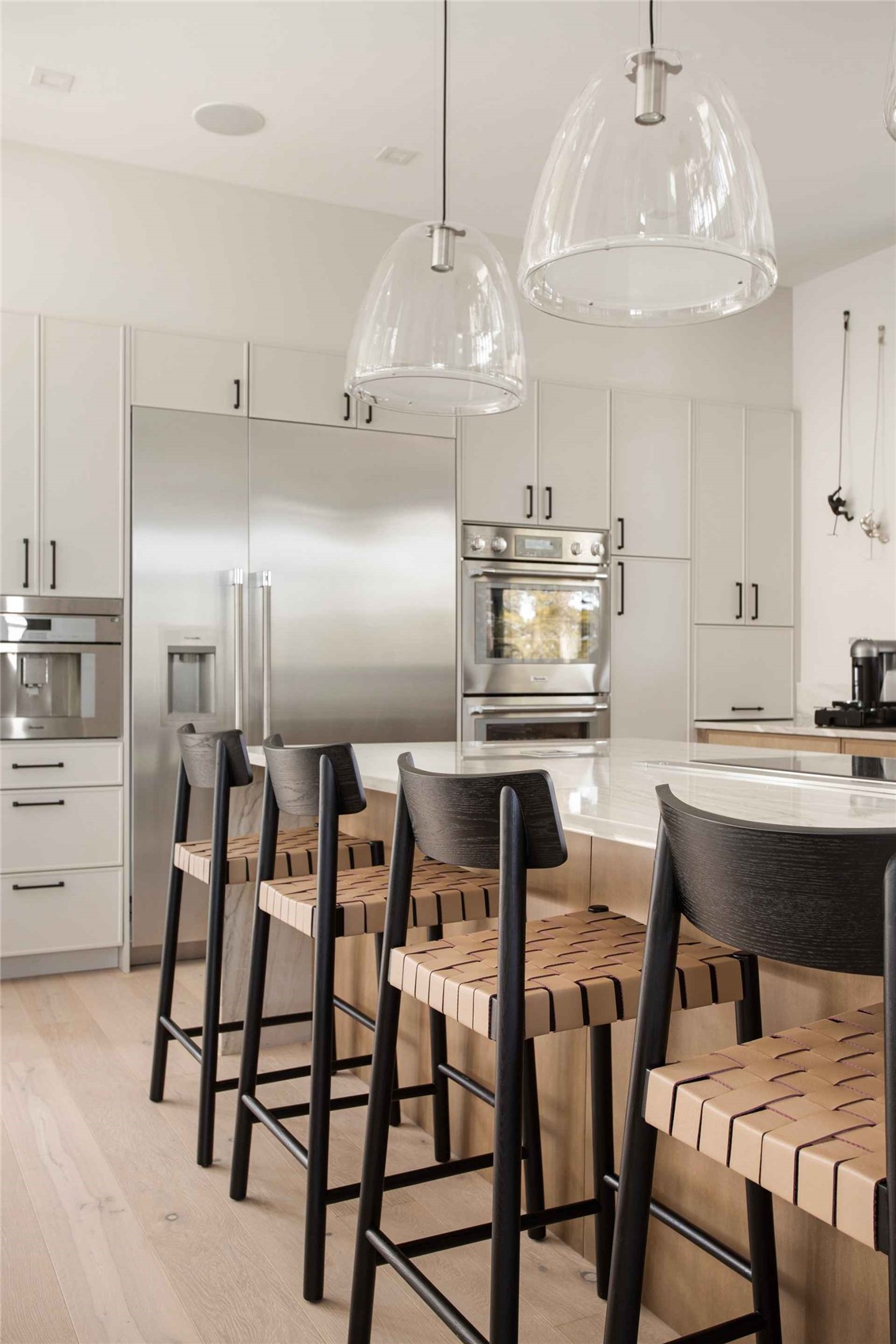 3764 Ski Hill Road Breckenridge, CO 80424 - Photo 4 of 30 Kitchen featuring a breakfast bar area, stainless steel appliances, light wood-style flooring, and pendant lighting
