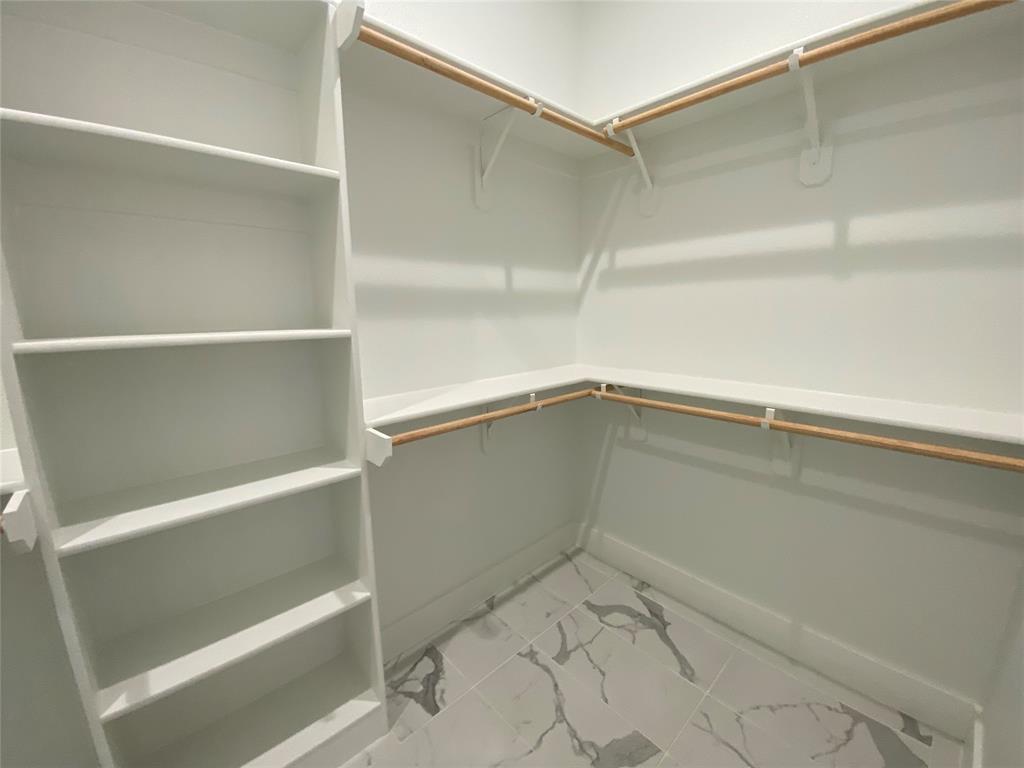 807 South Glasgow Drive Dallas, TX 75223 - Photo 16 of 25 a view of an empty walk in closet