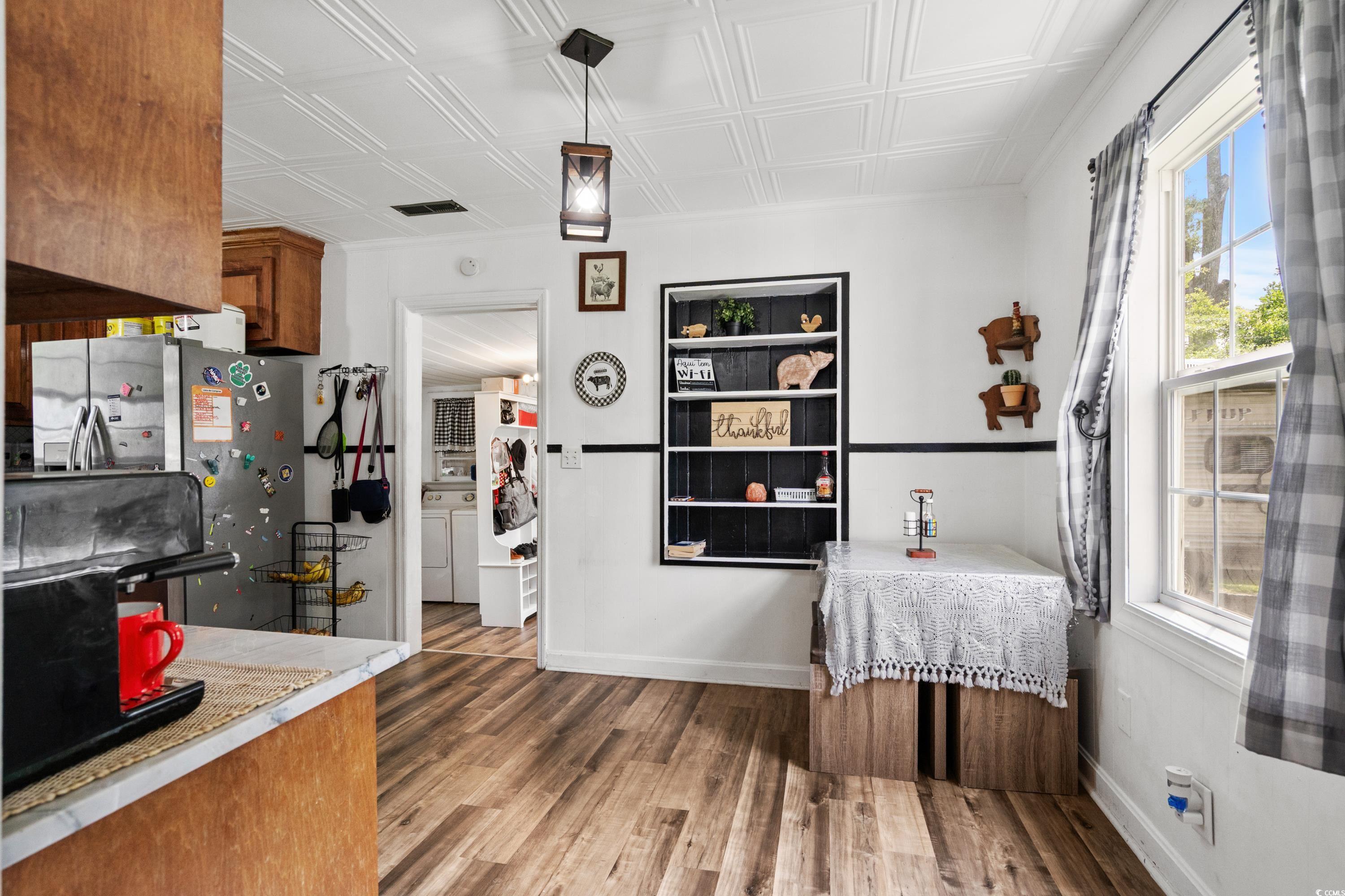708 15th Avenue Conway, SC 29526 - Photo 19 of 38 Dining space featuring light wood finished floors and an ornate ceiling