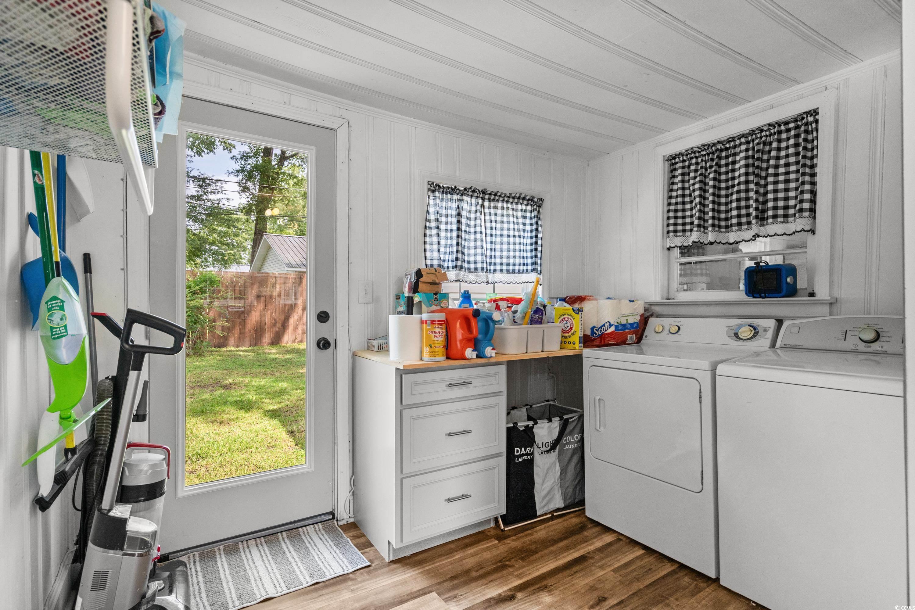708 15th Avenue Conway, SC 29526 - Photo 20 of 38 Dining space with an ornate ceiling, wood finished floors, healthy amount of natural light, and washer and clothes dryer