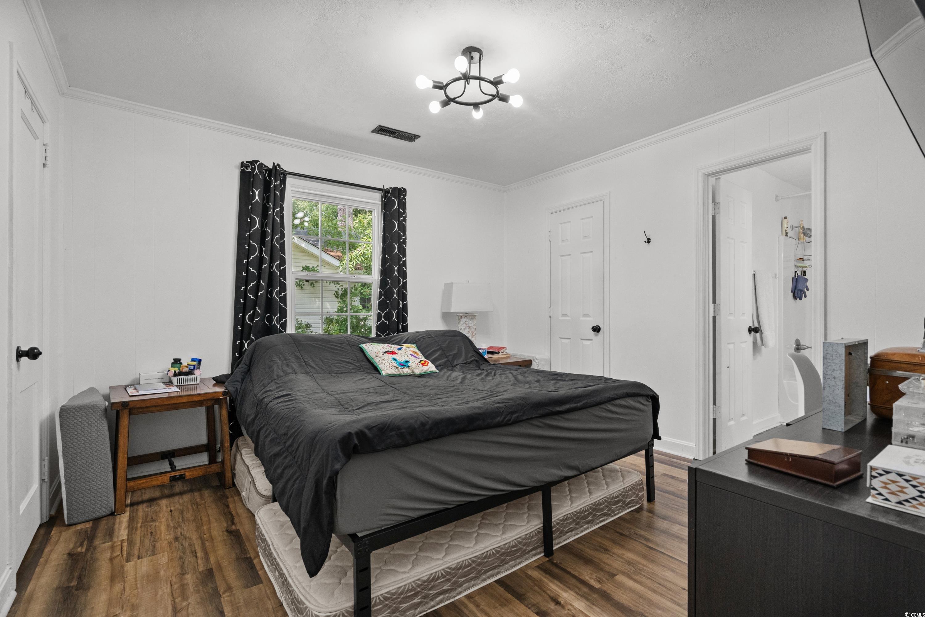 708 15th Avenue Conway, SC 29526 - Photo 5 of 38 Living area with light wood-style flooring, a textured ceiling, and crown molding