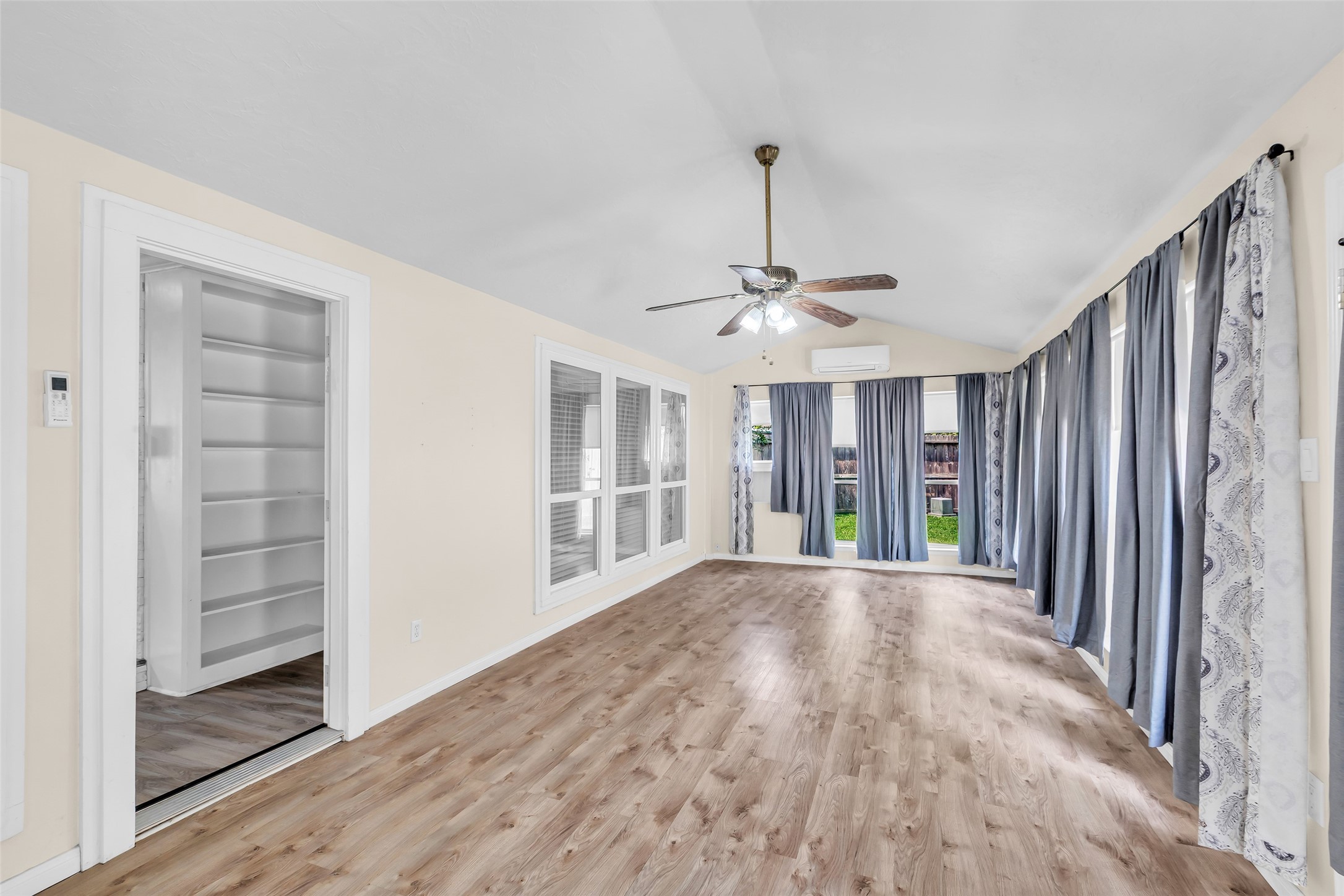 3302 Candlelon Drive Spring, TX 77388 - Photo 22 of 29 a view of an empty room with wooden floor and a window