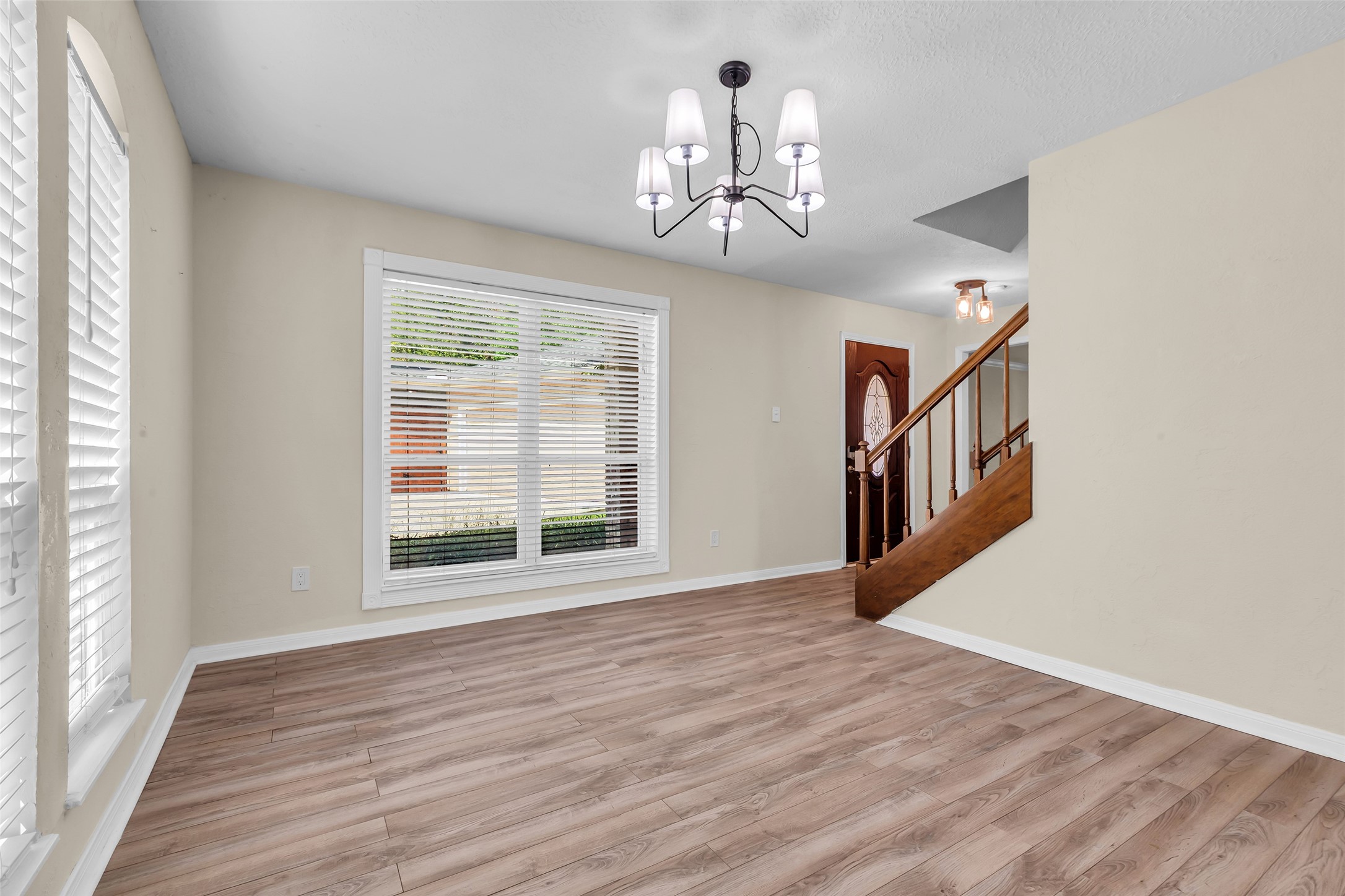 3302 Candlelon Drive Spring, TX 77388 - Photo 8 of 29 a view of an empty room with wooden floor and a window