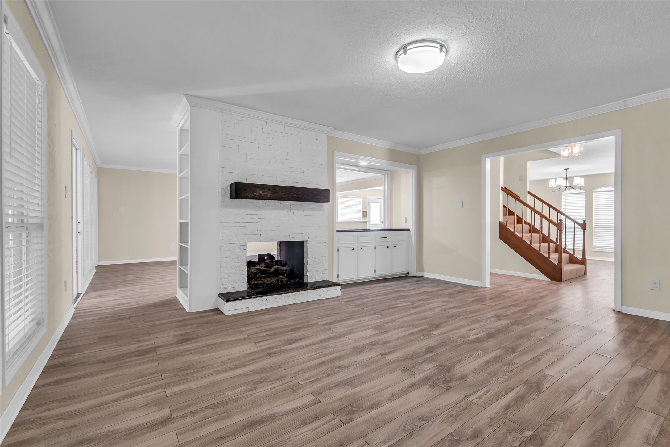 3302 Candlelon Drive Spring, TX 77388 - Photo 9 of 29 an empty room with wooden floor and fireplace