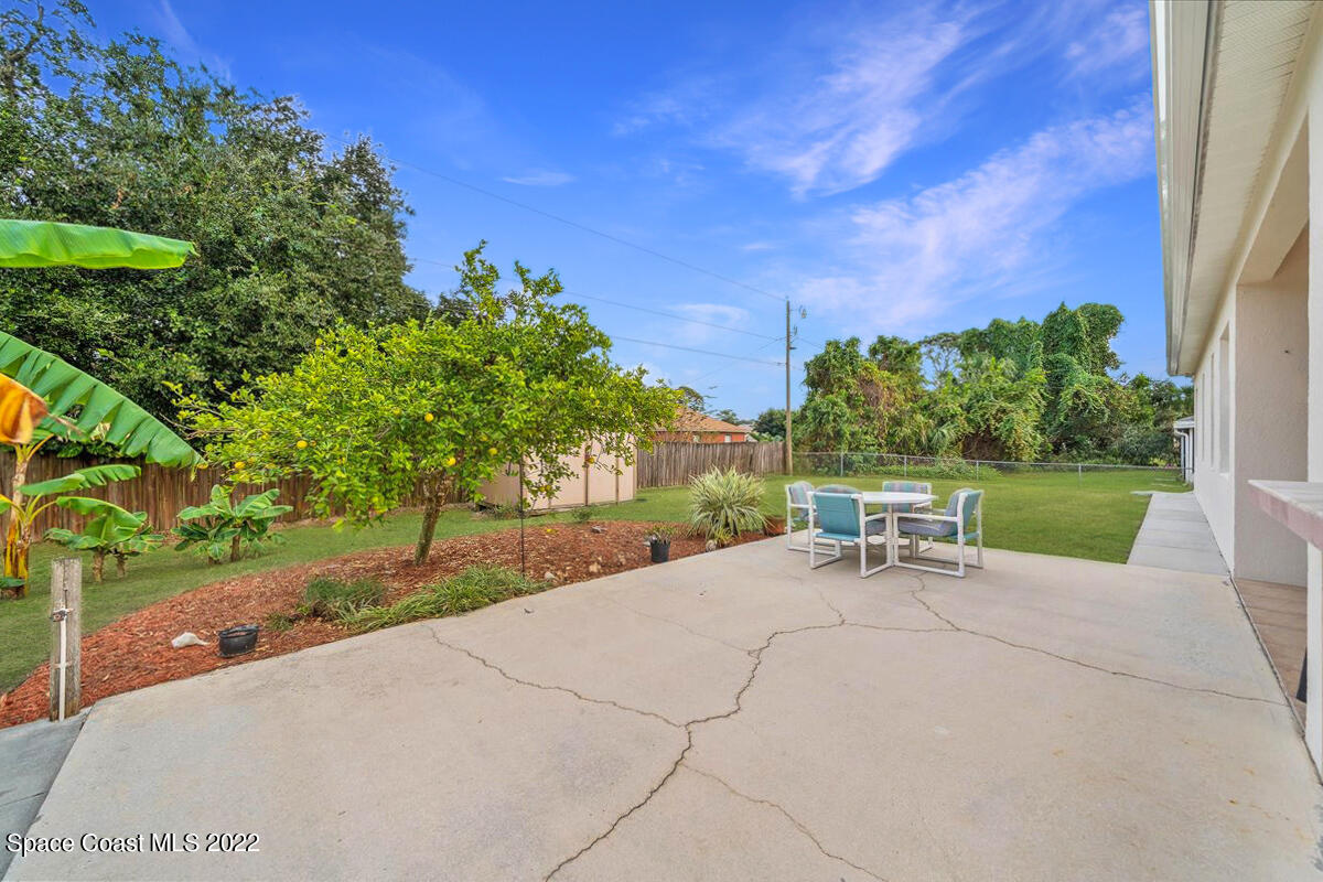 6949 Bryant Road Cocoa, FL 32927 - Photo 29 of 33 a view of a backyard with sitting area
