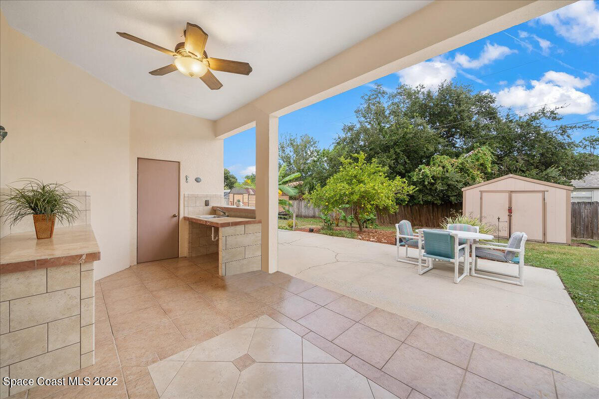 6949 Bryant Road Cocoa, FL 32927 - Photo 5 of 33 a view of a livingroom with furniture and a yard