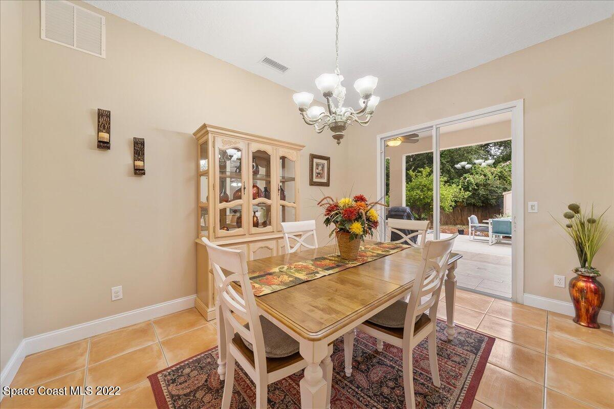 6949 Bryant Road Cocoa, FL 32927 - Photo 10 of 33 a view of a dining room with furniture window and outside view