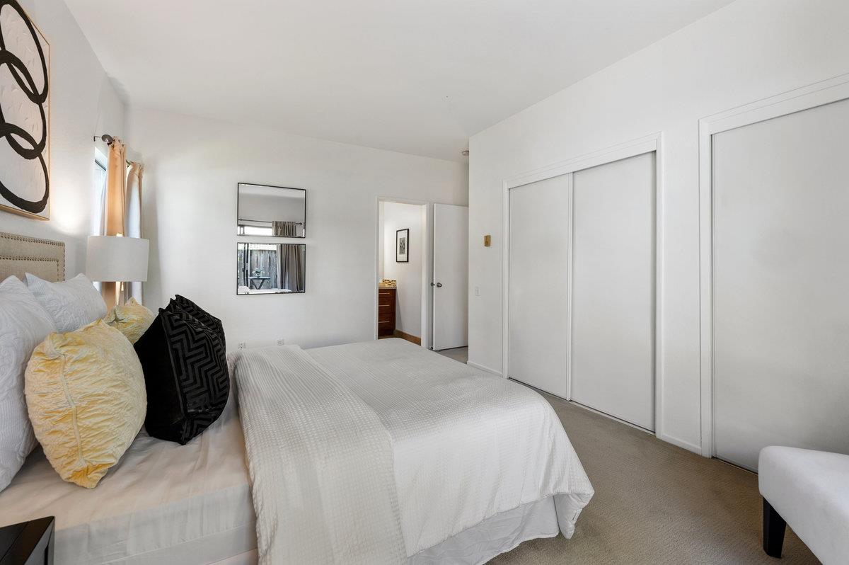 874 Wharfside Road San Mateo, CA 94404 - Photo 25 of 54 a bedroom with a bed and a chair