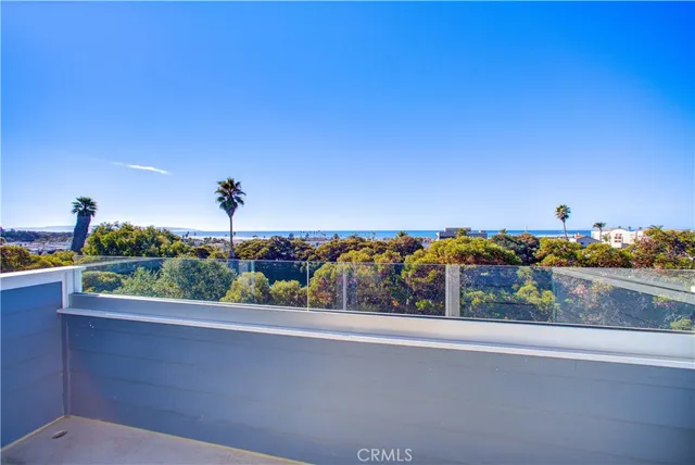 a kitchen with a sink dining table and chairs