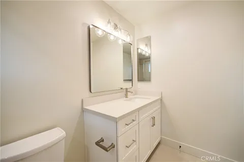 a bed sitting in front of a house with a backyard