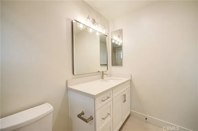 a bed sitting in front of a house with a backyard