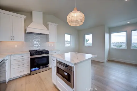 an aerial view of a house with a city view