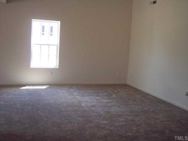 3213 Hornblower Trail Raleigh, NC 27610 - Photo 3 of 9 an empty room with a window
