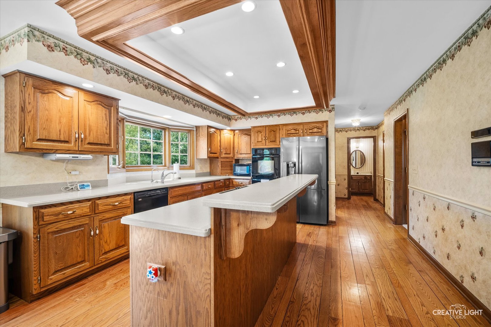 3112 Turnberry Road St. Charles, IL 60174 - Photo 9 of 43 a kitchen with counter top space and wooden floor