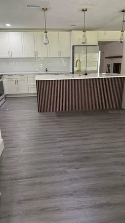 a view of a kitchen with cabinets