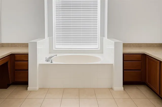 a bathroom with a bathtub and a sink