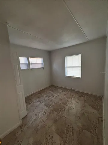 a view of an empty room and window