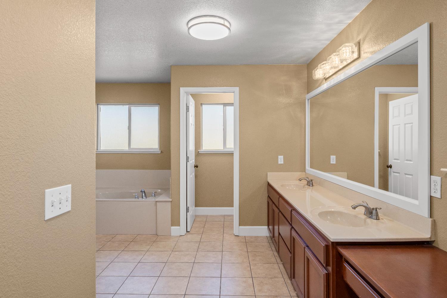 637 Rebekah Court Ripon, CA 95366 - Photo 50 of 69 a bathroom with a sink a toilet and mirror