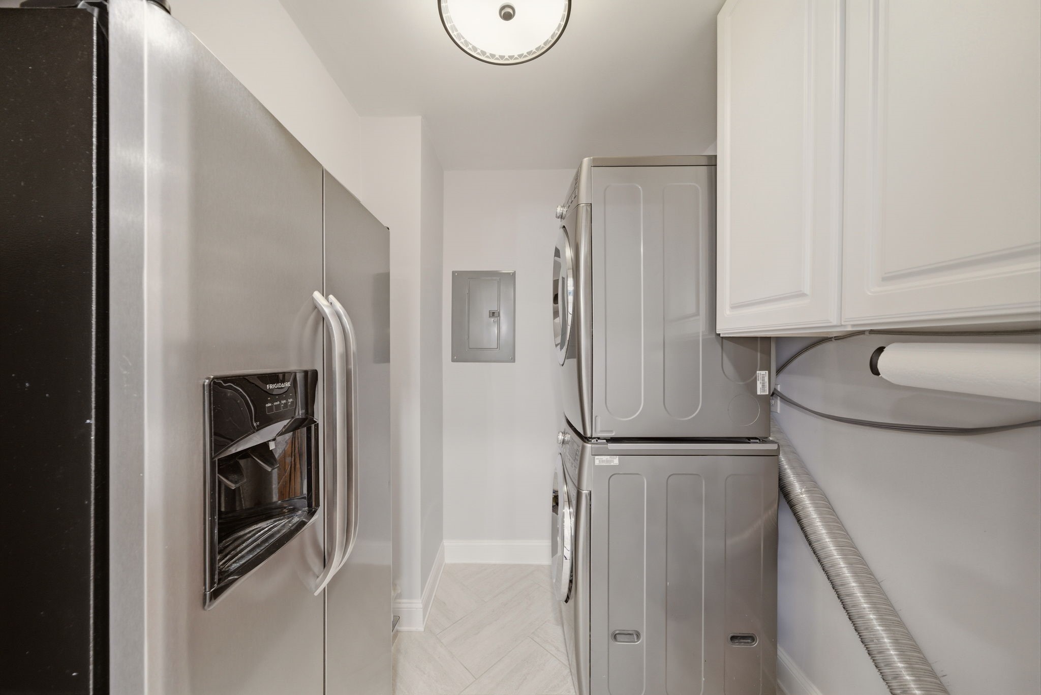 6452 Burgoyne Road, Unit 100 Houston, TX 77057 - Photo 18 of 44 a kitchen with stainless steel appliances granite countertop a refrigerator and a sink