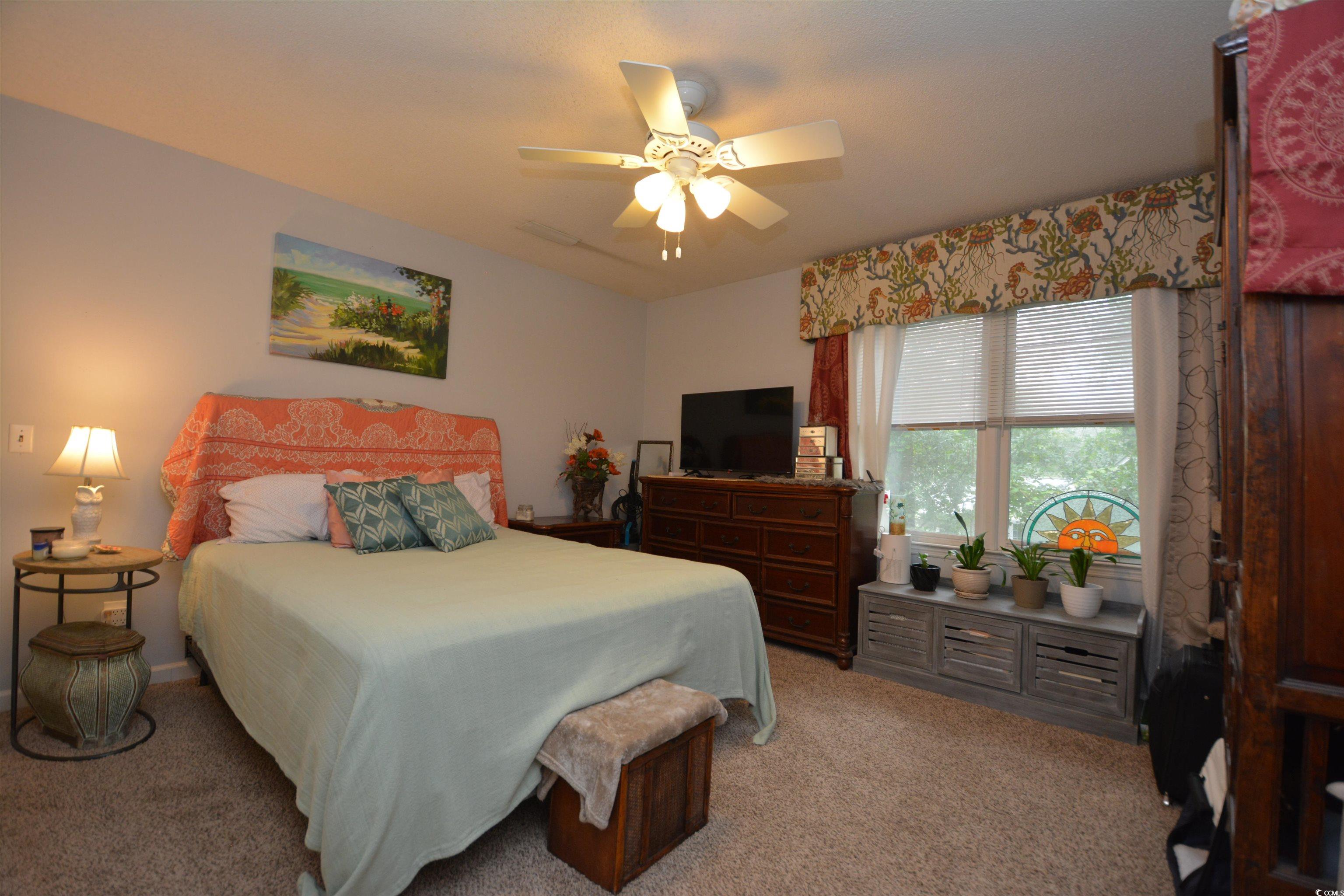 787 Causey Road Murrells Inlet, SC 29576 - Photo 11 of 35 Bedroom featuring ceiling fan and light carpet