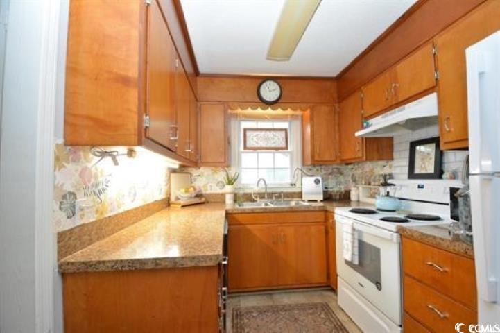 787 Causey Road Murrells Inlet, SC 29576 - Photo 19 of 35 Kitchen with sink, white appliances, light stone c