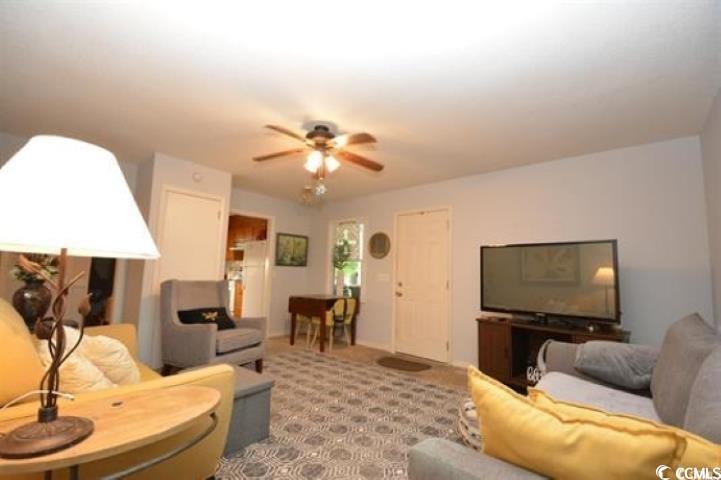 787 Causey Road Murrells Inlet, SC 29576 - Photo 21 of 35 Living room with ceiling fan and light carpet