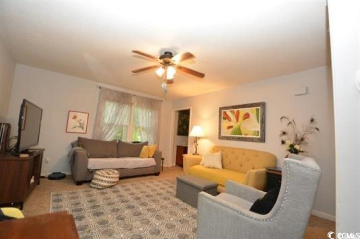 787 Causey Road Murrells Inlet, SC 29576 - Photo 22 of 35 Carpeted living room featuring ceiling fan