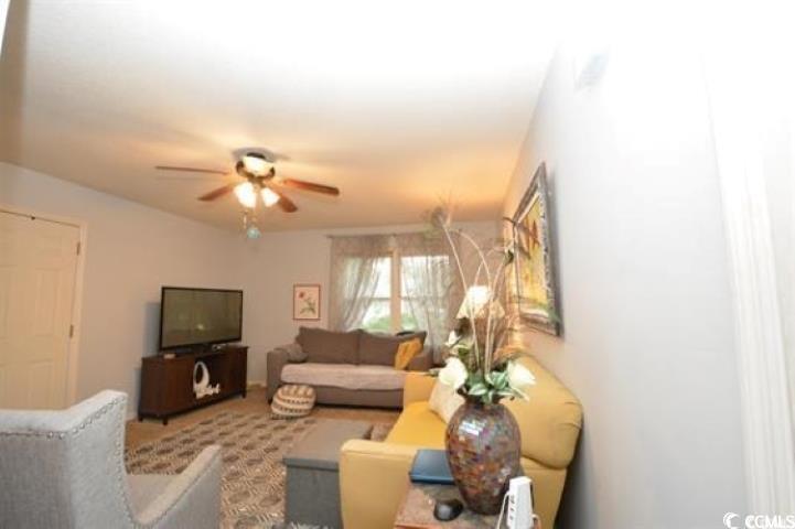 787 Causey Road Murrells Inlet, SC 29576 - Photo 24 of 35 Carpeted living room featuring ceiling fan
